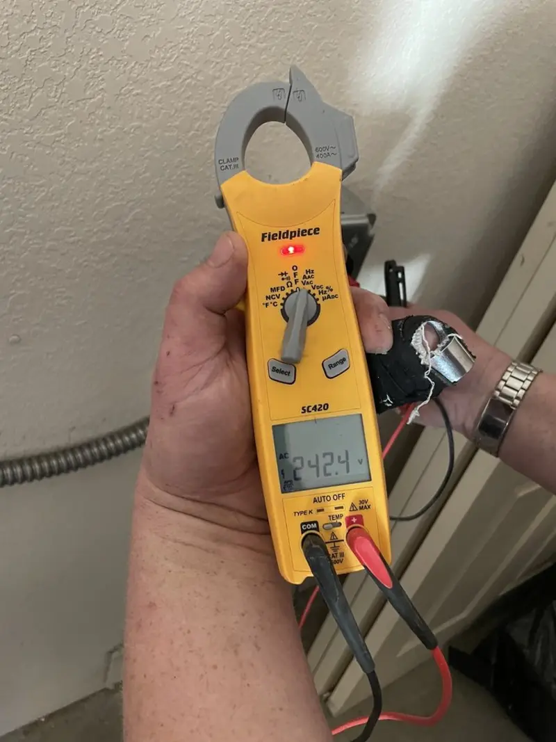 Voltage testing with clamp meter during Electrical Installation Services in Harrisburg